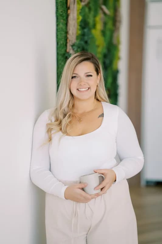 Professional headshot of Katherine Collins, Registered Psychotherapist (Qualifying) (ON)