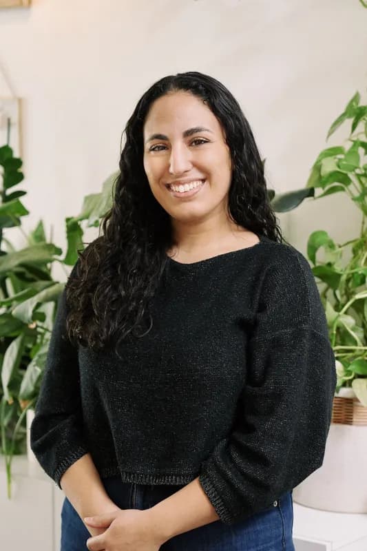 Professional headshot of Maya Dousti, Registered Psychotherapist (ON)